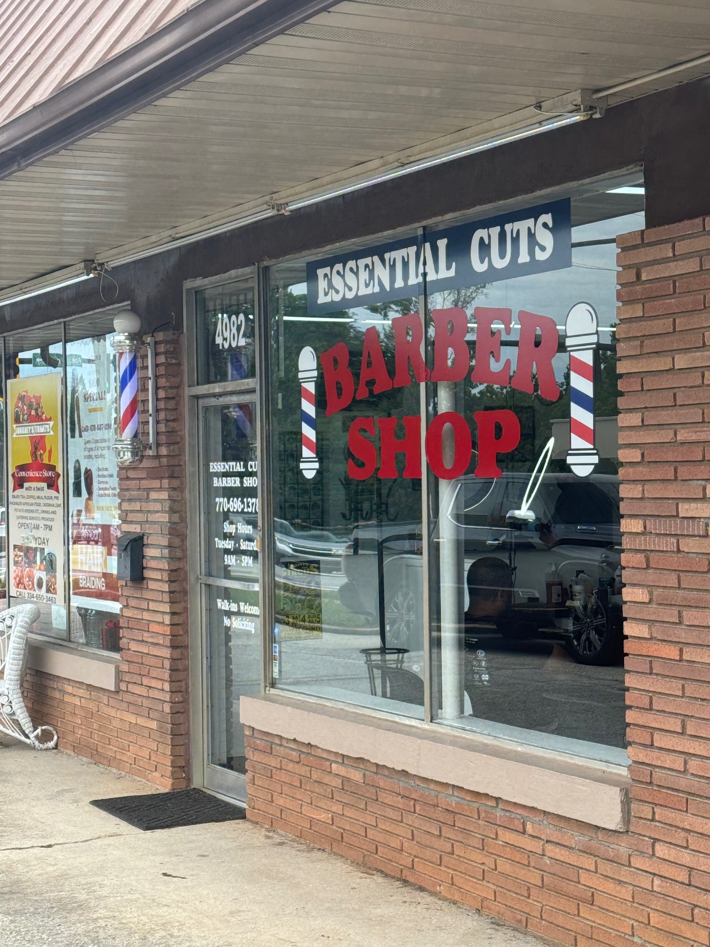 Essential Cuts Barbershop storefront in Lilburn, Georgia